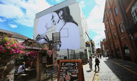 A mural of two women kissing in Belfast, 2016.