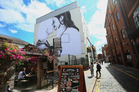 A mural of two women kissing in Belfast, 2016.
