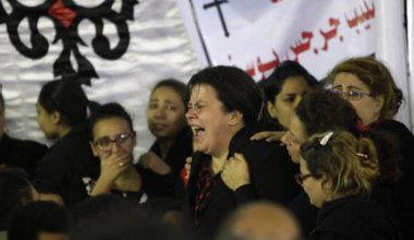 Relatives cry at the church blast victims' funeral in Tanta city