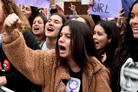 Women protest for equal pay and dignity at work in Barcelona, March 2018. 