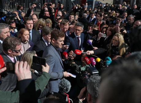 Ireland rugby player Paddy Jackson (centre) speaking outside Belfast Crown Court, 28 March 2018.