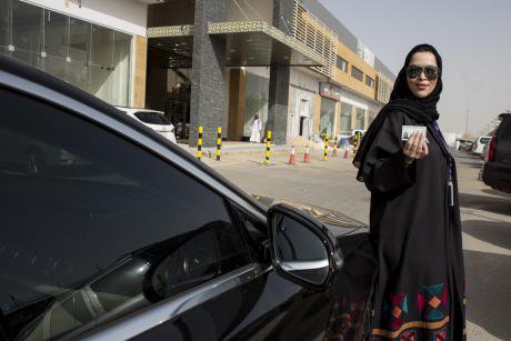 A Saudi woman poses with her new driving license after the country’s ban on women driving was lifted in June, 2018.