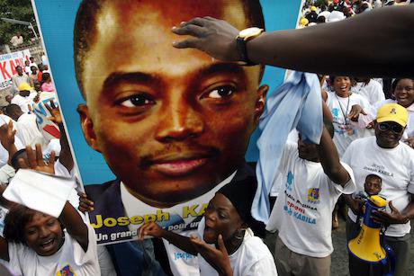 Supporters of President Joseph Kabila dance at a political rally held in 2006 in Kinshasa, DR Congo. The government is currently