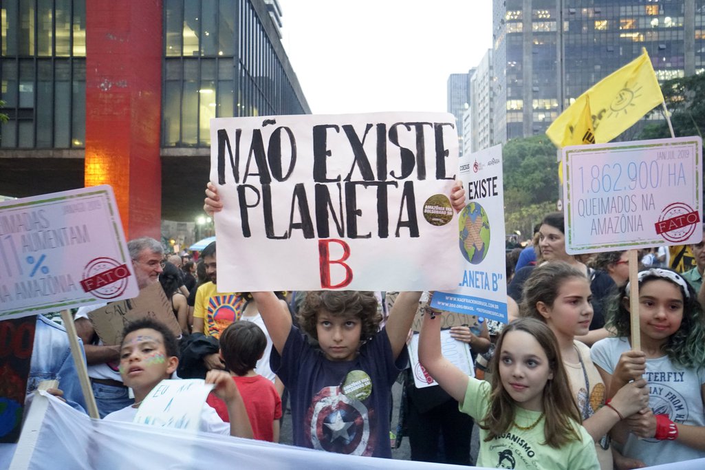 Schoolchildren hold up placards at a march in São Paulo during the global climate strike on 20 September, 2019.