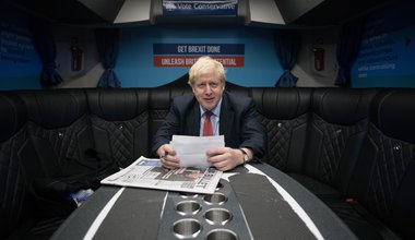 Boris Johnson, works in his campaign bus as he heads to the Kent Event Centre, Maidstone, 6 December 2019