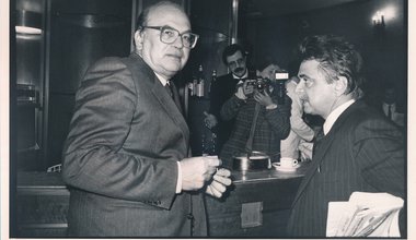 Secretary of the Italian Socialist Party Bettino Craxi and Secretary of the Democrats of the Left Achille Occhetto having a conversation in a bar. Italy, 1990s