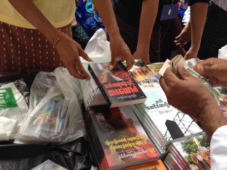 A woman sells books promoting MaBaTha, at the movement&#x27;s 2017 annual conference in Yangon.