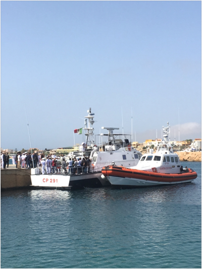 Survivors and officials board boats in preparation for the 3 October memorial at sea (Author provided)