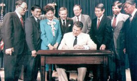 President Reagan signing the Civil Liberties Act into law, 1988.