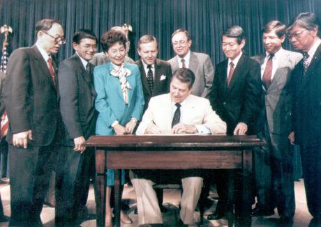 President Reagan signing the Civil Liberties Act into law, 1988.