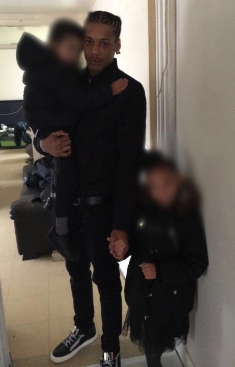 Rashan Charles, the eldest of seven children, with his little brother and sister. (Family)