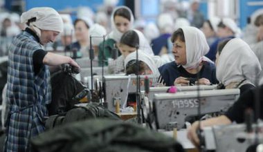 Russian female prisoners at sewing machines. 