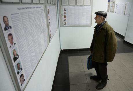 A Kyiv man weighs his options.