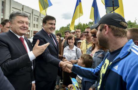 President Petro Poroshenko (left) and Saakashvili (centre) meet residents in Odessa