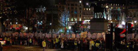 Photo of marchers in a city street at night