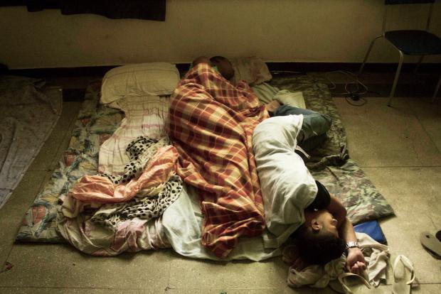School students sleeping on the floor of their school in Meier, Rio de Janeiro, Brazil