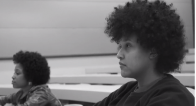two Black women students alone in a lecture hall