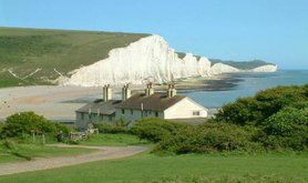 Seven_Sisters_cliffs_and_the_coastguard_cottages,_from_Seaford_Head_showing_Cuckmere_Haven_(looking_east_-_2003-05-26)_0.jpg
