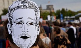 Snowden mask at Freedom not Fear march, Berlin. Flickr/mw238. Some rights reserved.