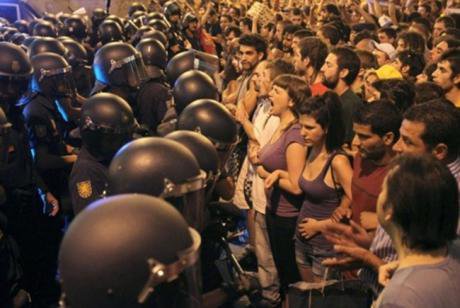 Spanish civilians confronting police in 2011