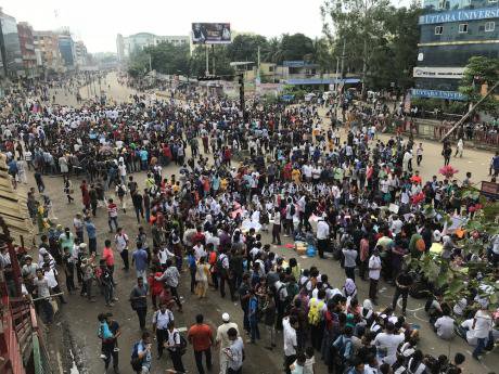 Students spilled onto the streets in Dhaka, shutting down major roads in protest