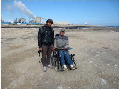 Nader Shkiwa and Mohamed Rigui on beach next to GCT Fertilizer Factory