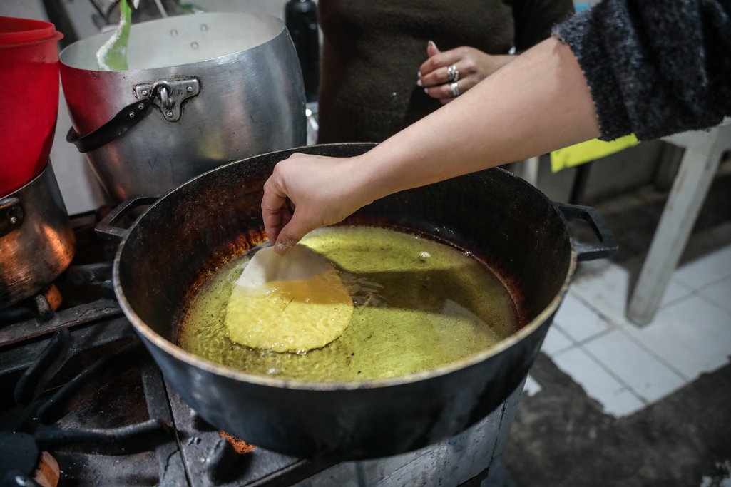 A cook from the Villa 21-24 neighbourhood in Buenos Aires city prepares ‘tortas fritas’