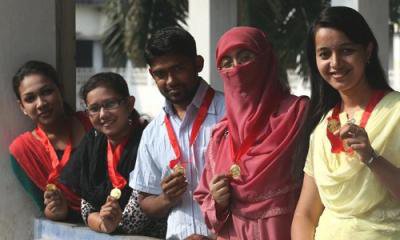 Five students show off their gold medals.