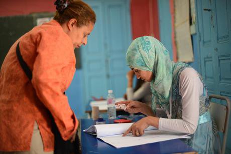 Legislative elections in Tunisia. Checking identity before the vote. 26 October  2014 Tunis.