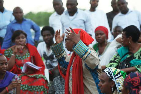 Woman talking and gesticulating at a rally