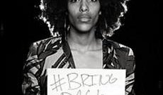 Bring Back Our Girls campaigner with placard and hashtag