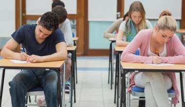 mixed group of students taking an exam