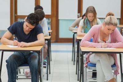 mixed group of students taking an exam
