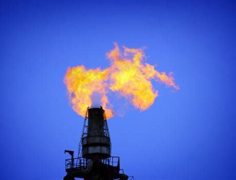 A gas flame burns at a gas refinery.