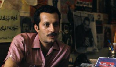 Ghassan at his desk, 1970. Bruno Barbey/ the Palestine poster project archive.