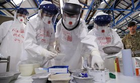 NHS doctors and nurses practise their medical skills at the Army's Ebola training facility, near York, 2014