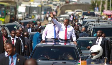 Kenyatta waves triumphantly to crowd