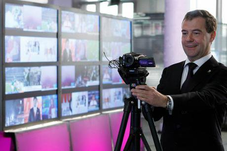 Former President Dmitry Medvedev in the studio at TV Rain playing with a camera.