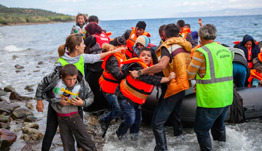 Refugees arrive in boats on European shores. 