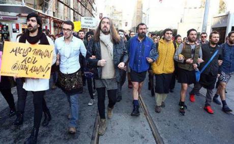 Men march with linked arms