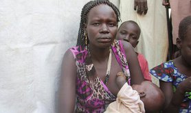 Refugee woman breastfeeding