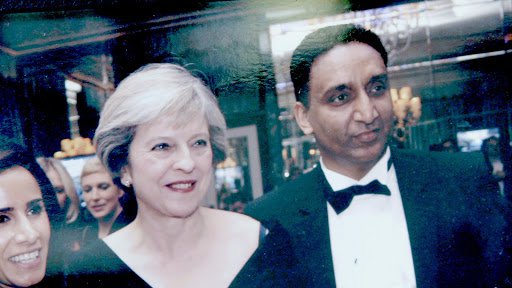 Sam Singh with the previous Conservative prime minister, Theresa May